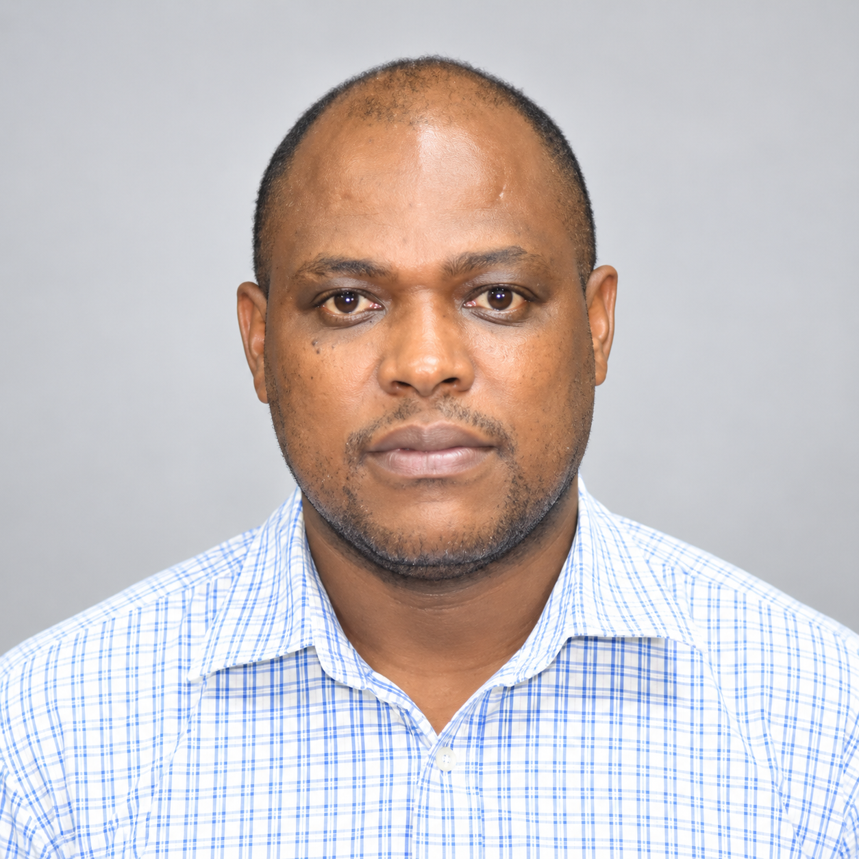 Dr. Naiman E. Shililiandumi